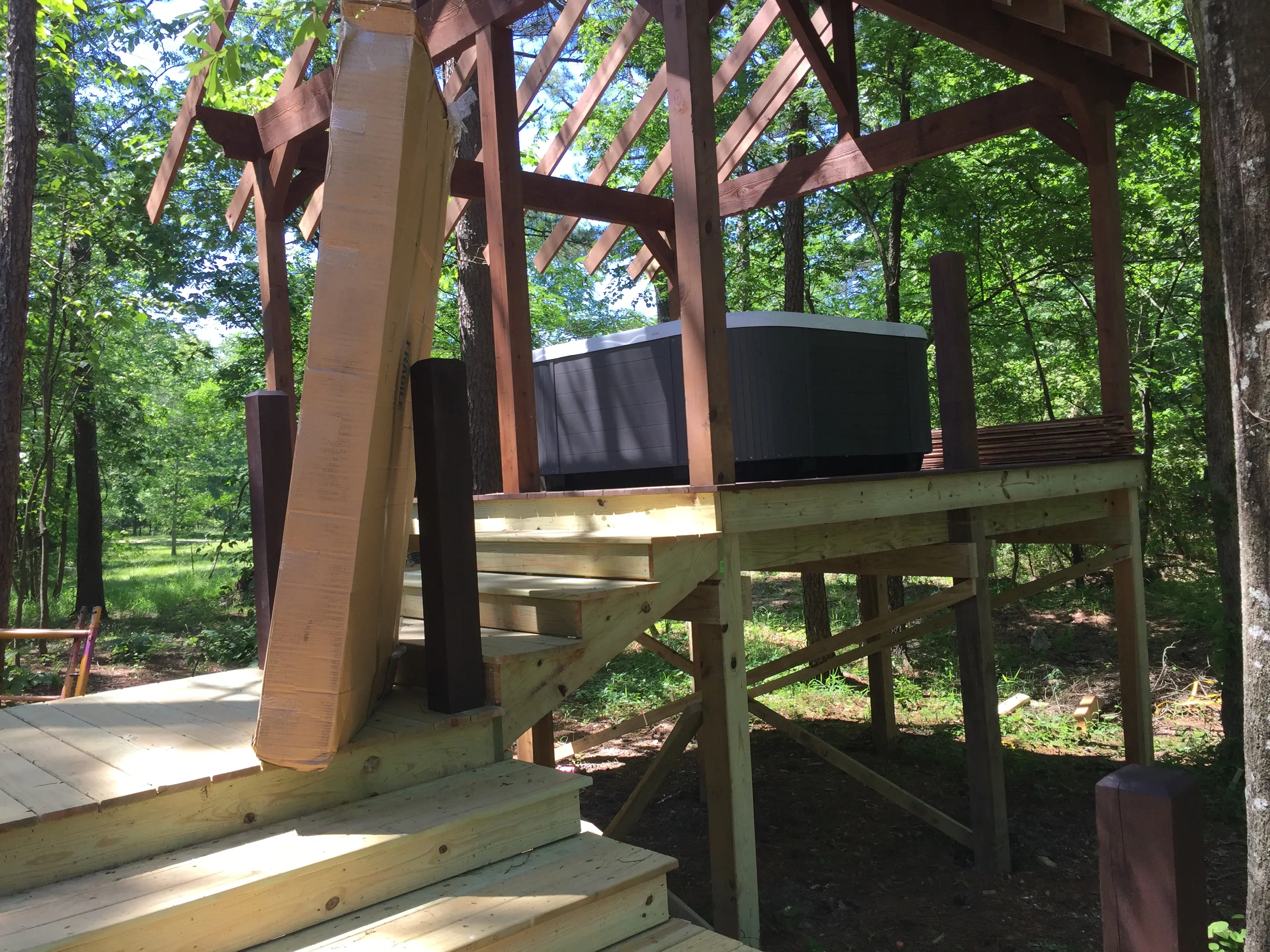Hot tub securely positioned on moving platform