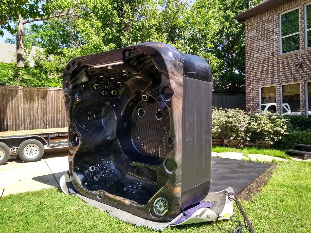 Hot tub being carefully positioned